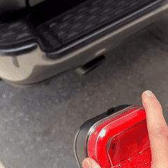 Hand positioning a removable trailer light
